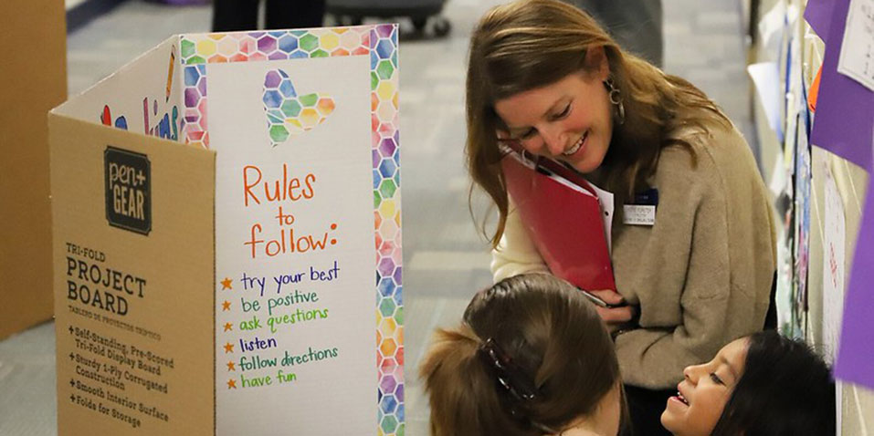 Katie Forster works with elementary students