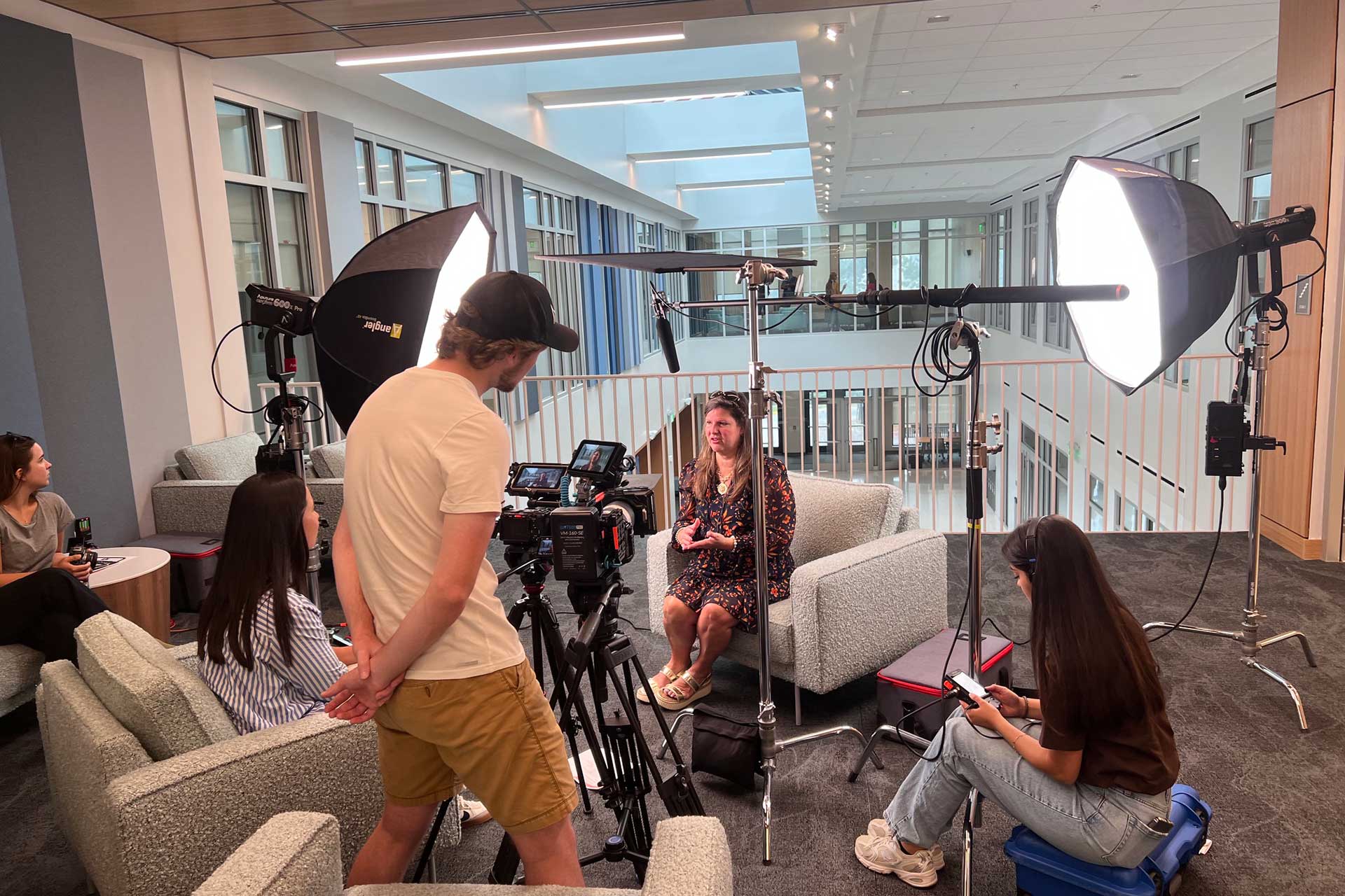 A professor getting interviewed for a promo video.