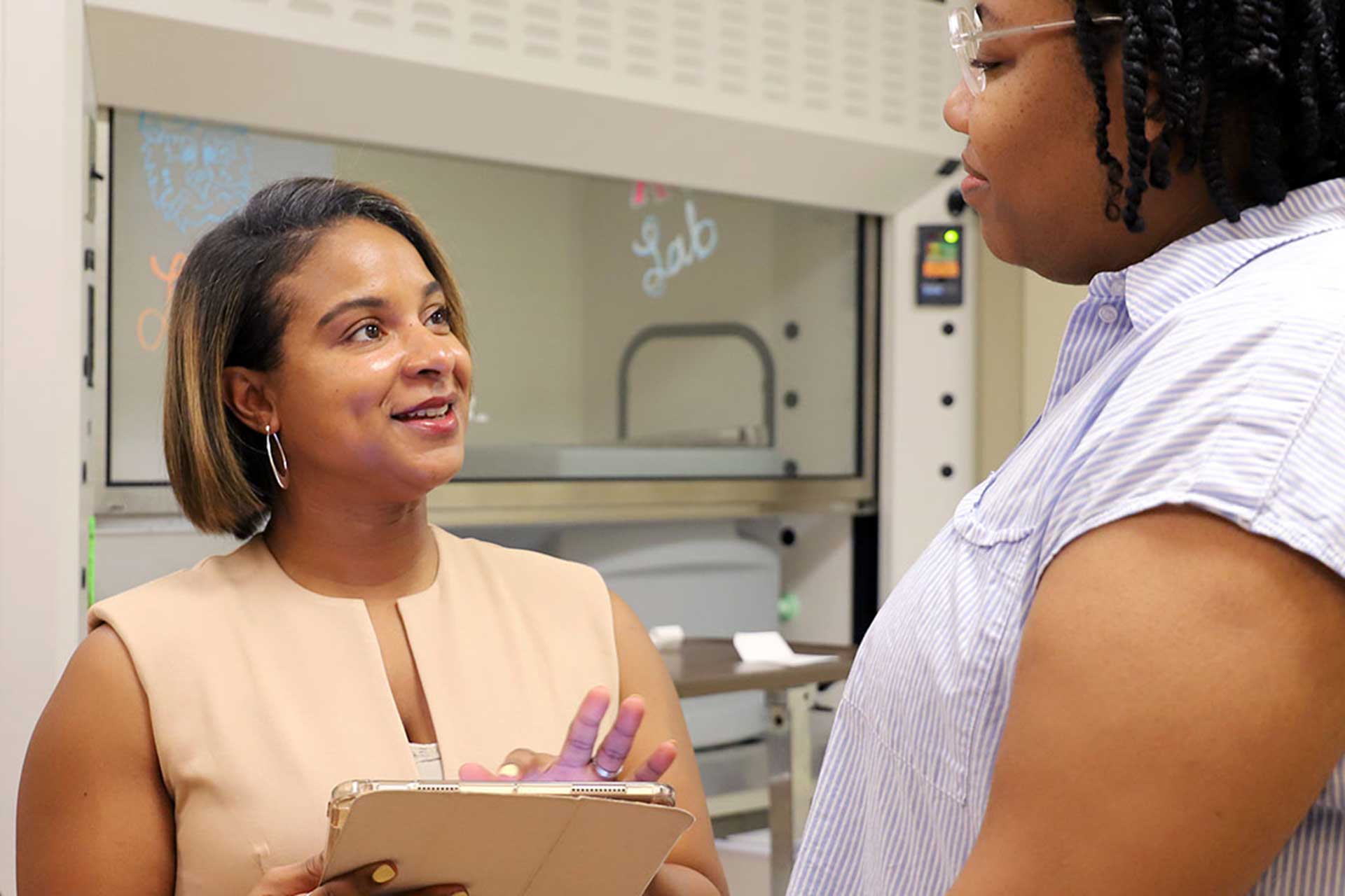 Dr. Hunter speaks with a student.