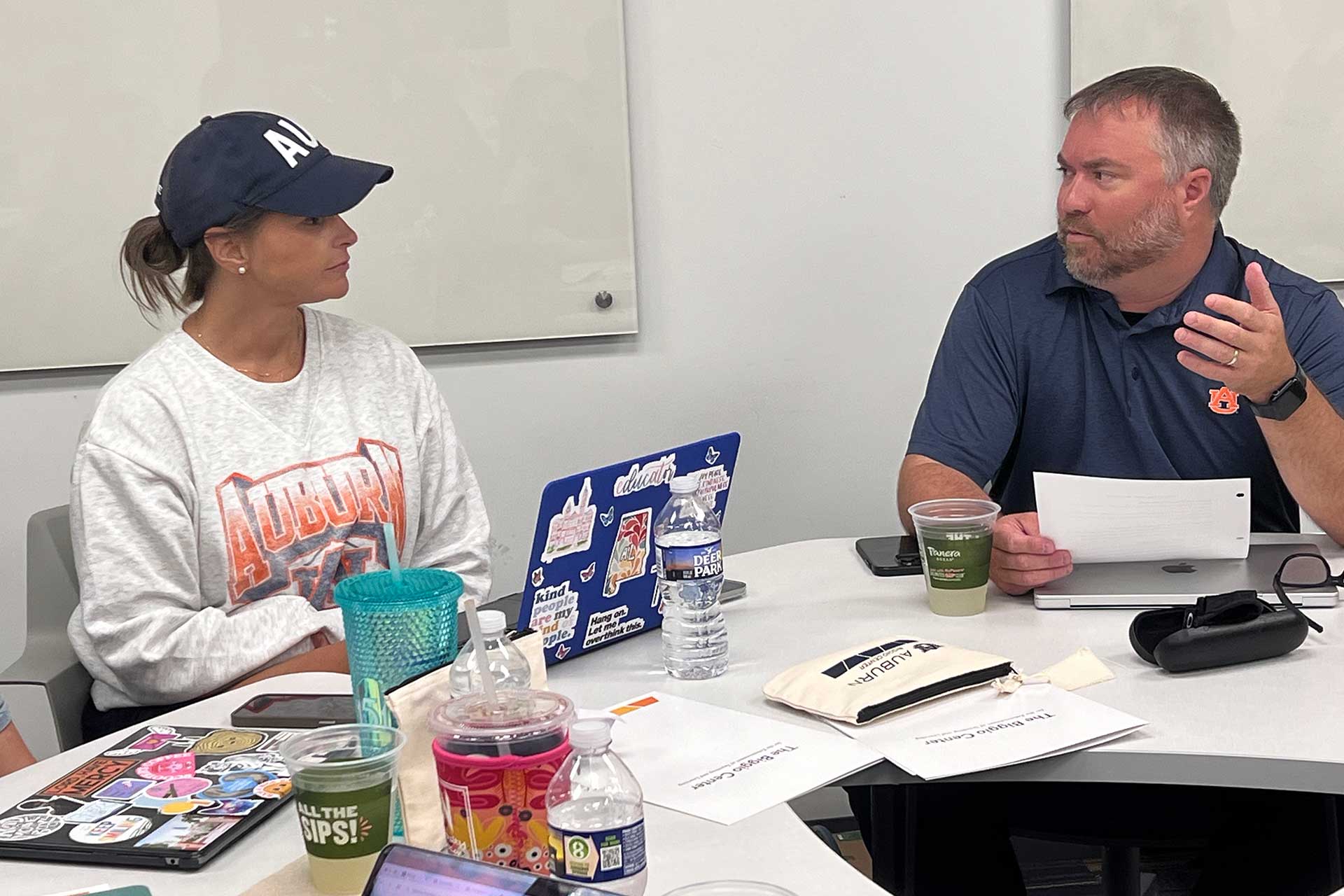 Dr. Marshall and a student in Biggio Hall at a classroom table.