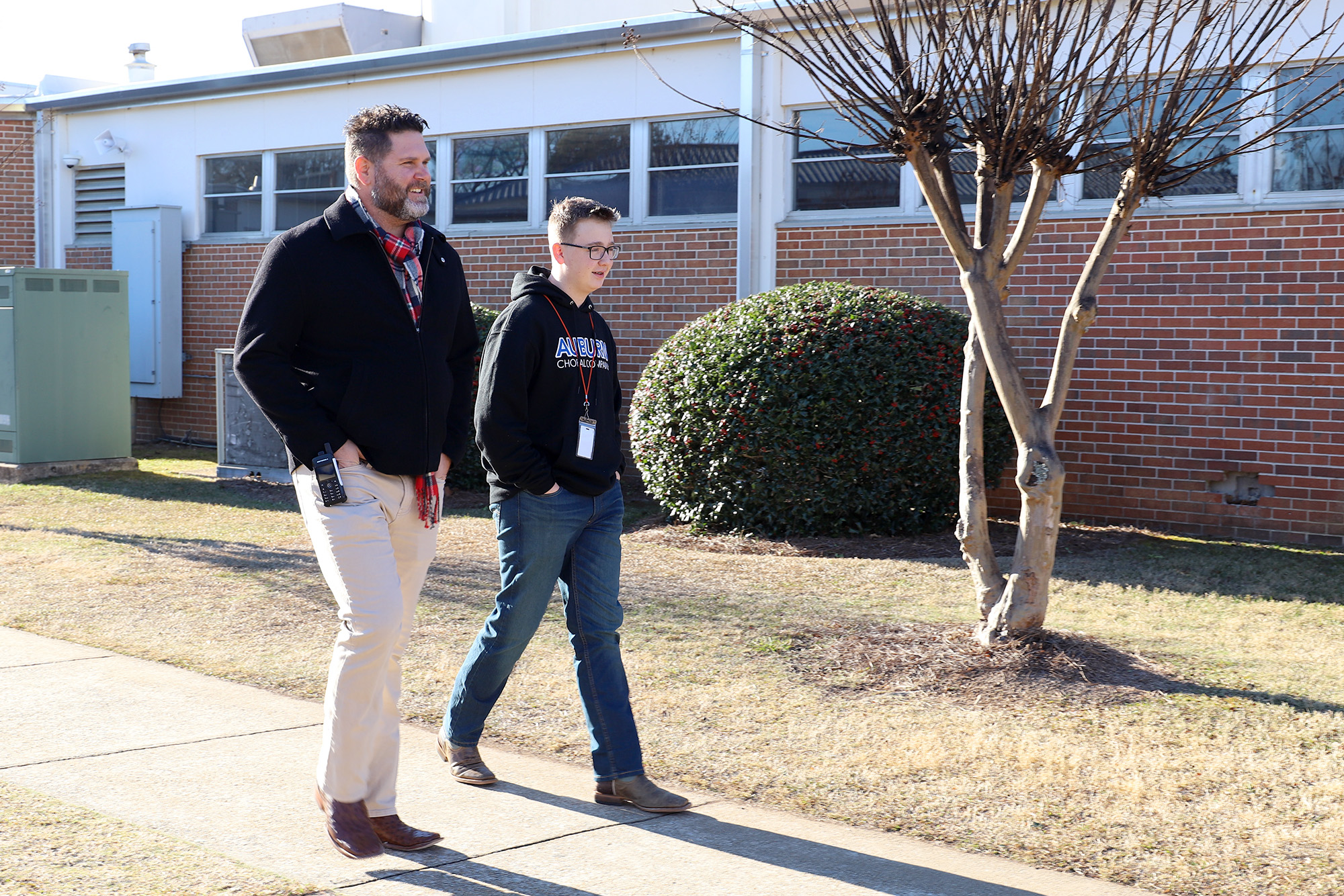 A counselor walks with a student