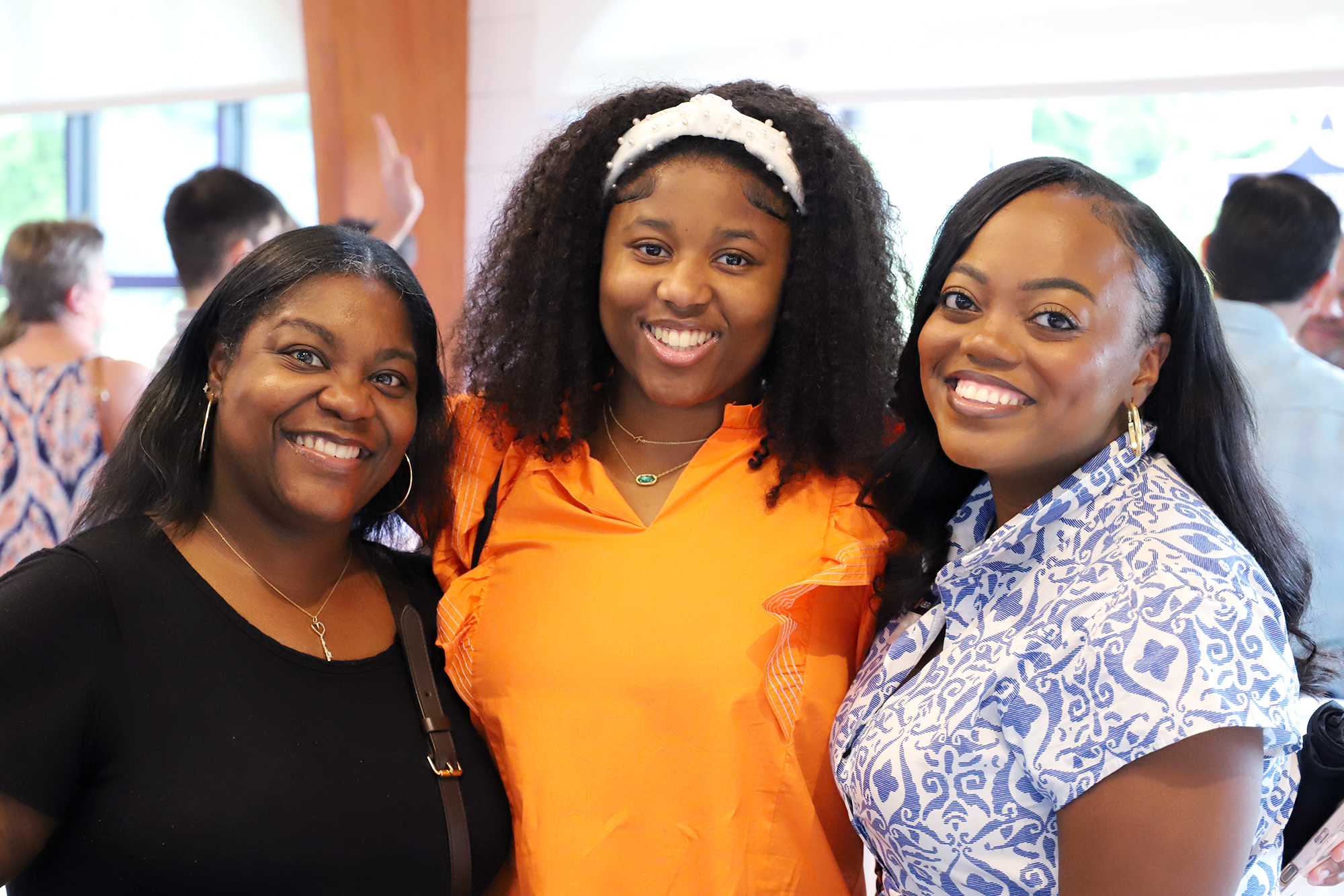women smiling at the red barn event