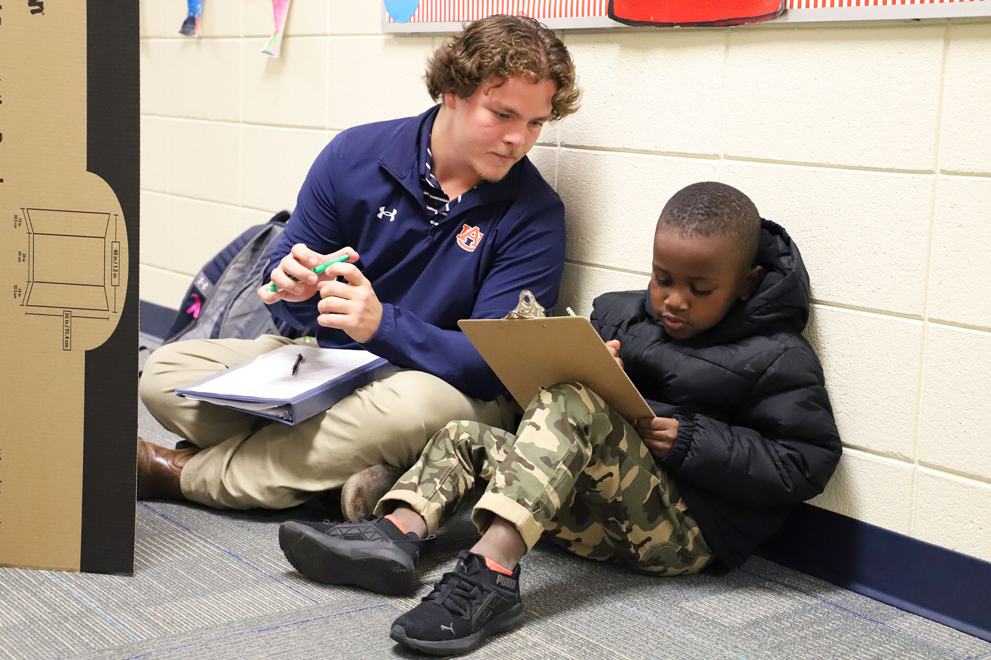 student teacher working with a first-grader
