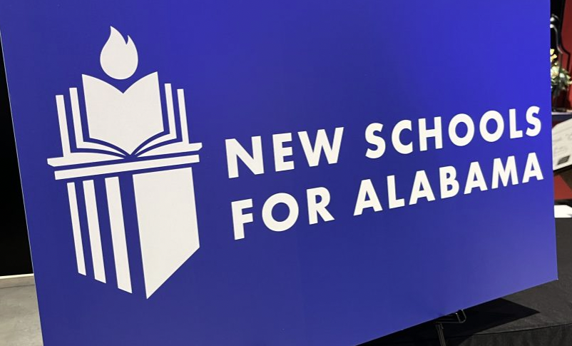 A sign reading new schools for Alabama