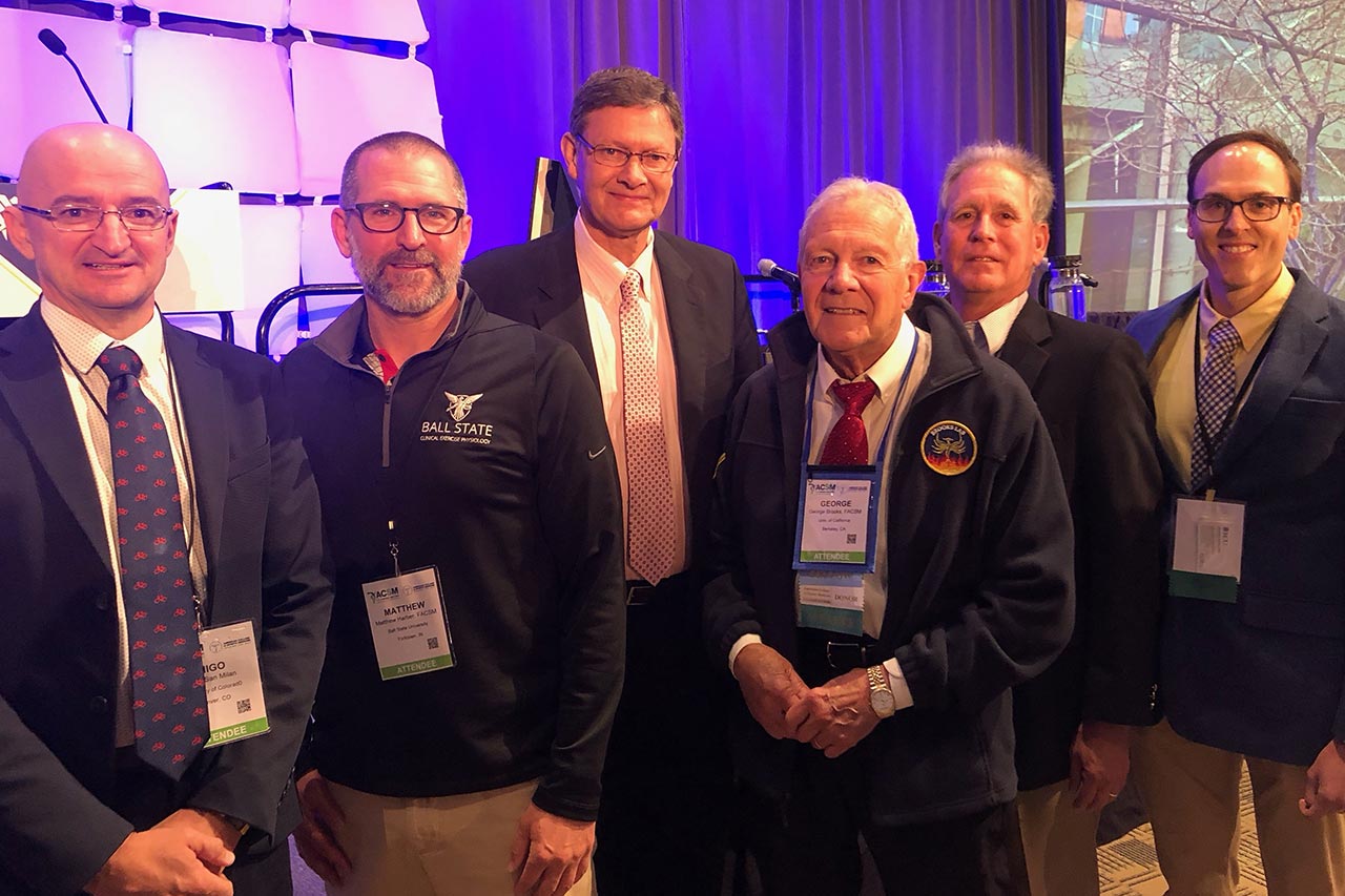 Bruce Gladden, center, at a Lactate Symposium.