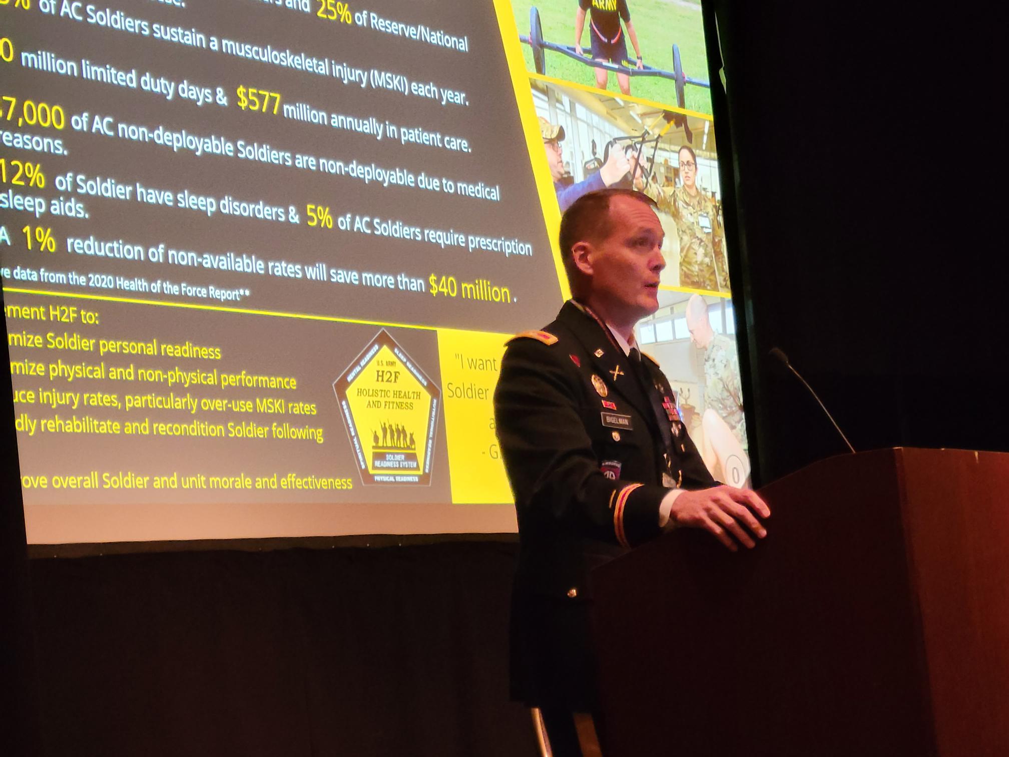 A military representative speaking at the Warrior Research Center's Tactical Athlete Summit.