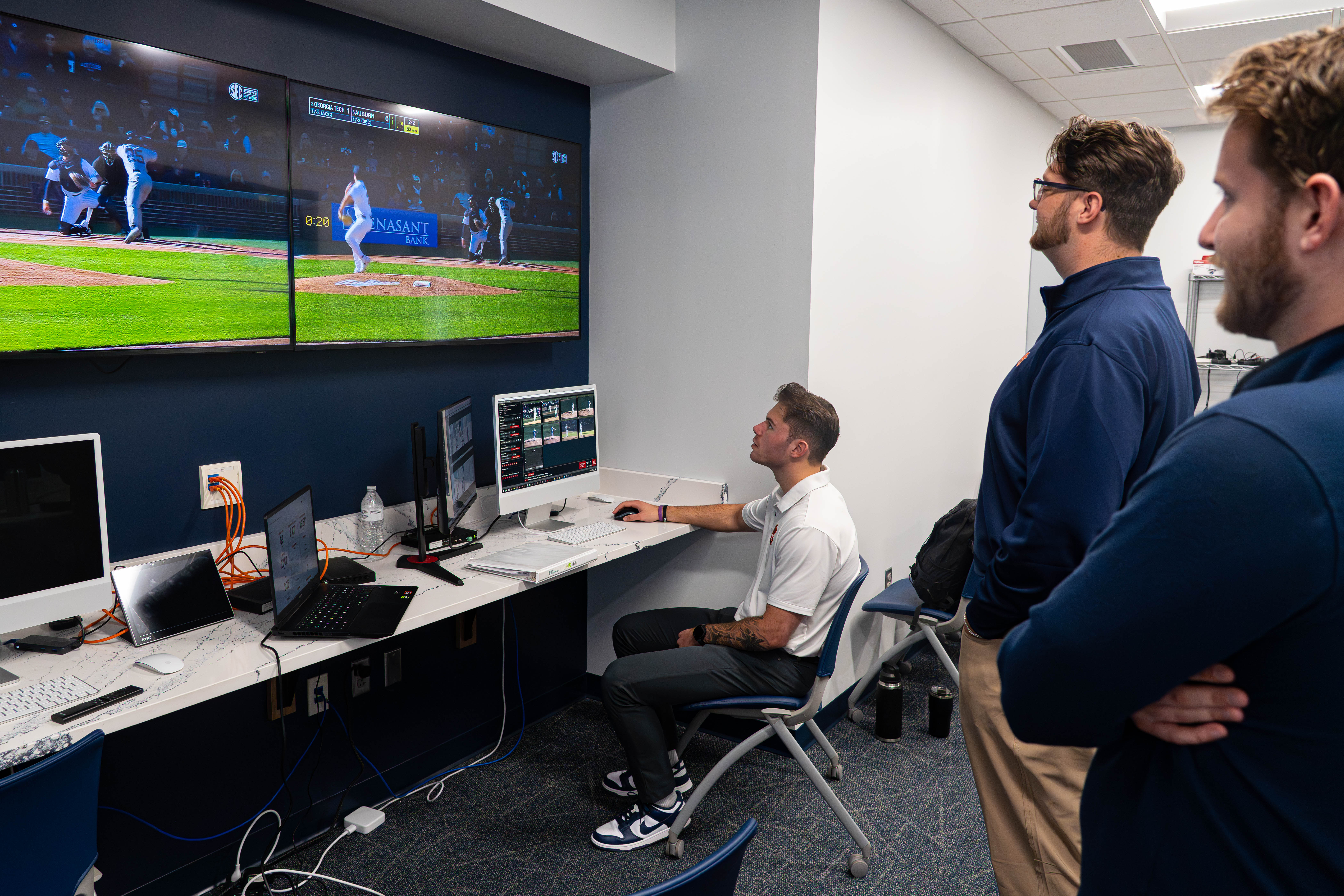Student researchers from the Sports Medicine and Movement Lab collect and analyze data in realtime during an Auburn Baseball game.