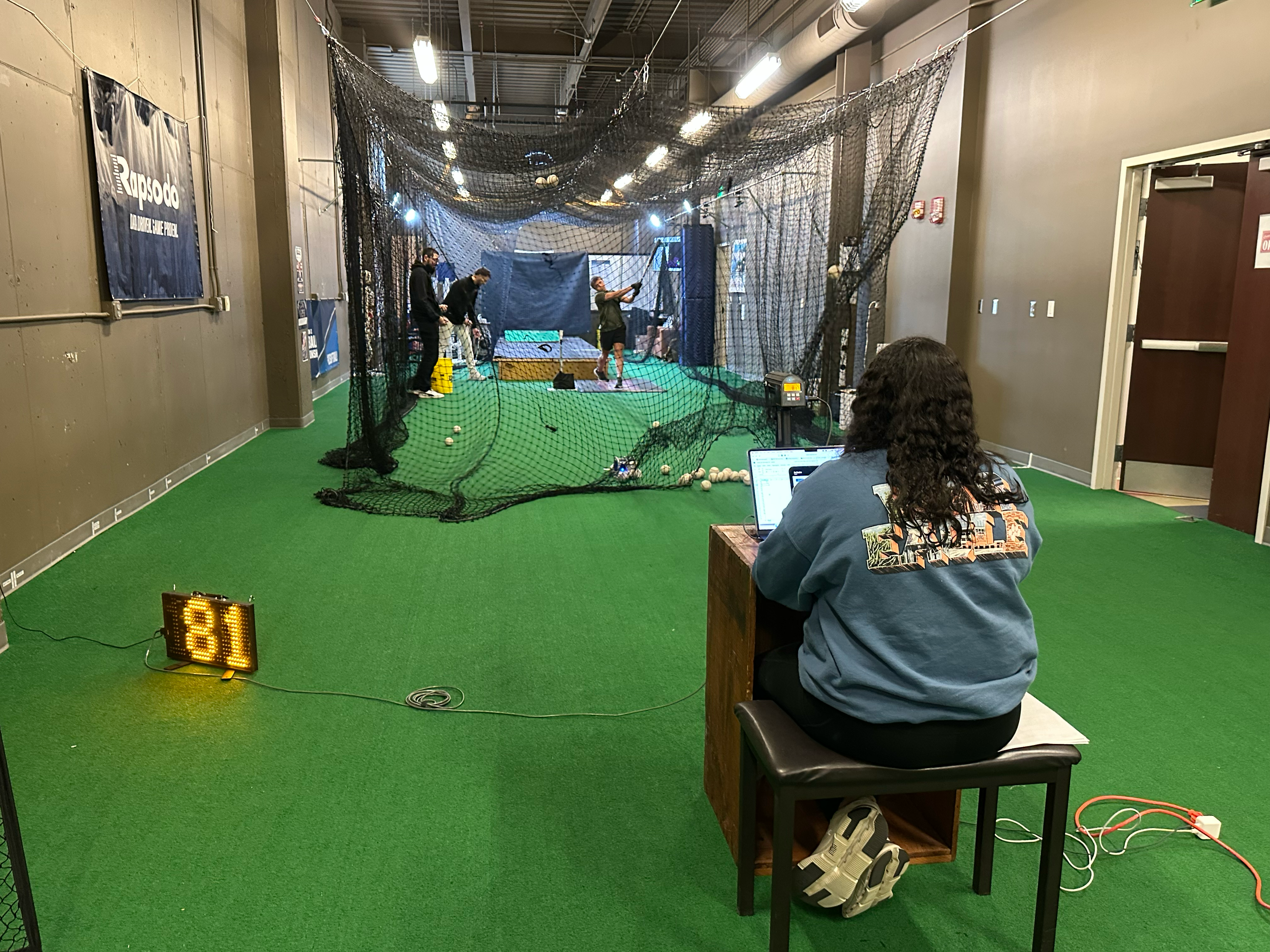 An image showing research on baseball pitching and hitting being conducted in the Sports Medicine and Movement Lab. 